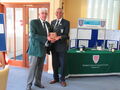 Club Captain Eddie Galjaard receiving the Plaque from President John White